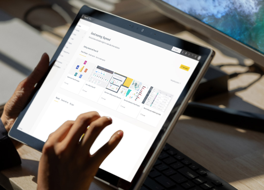 Person looking at Power BI on tablet device